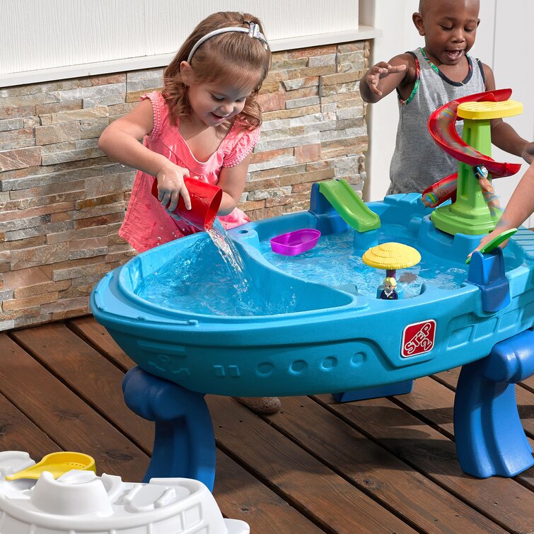 Step2 fiesta cruise sand & water table store with umbrella play